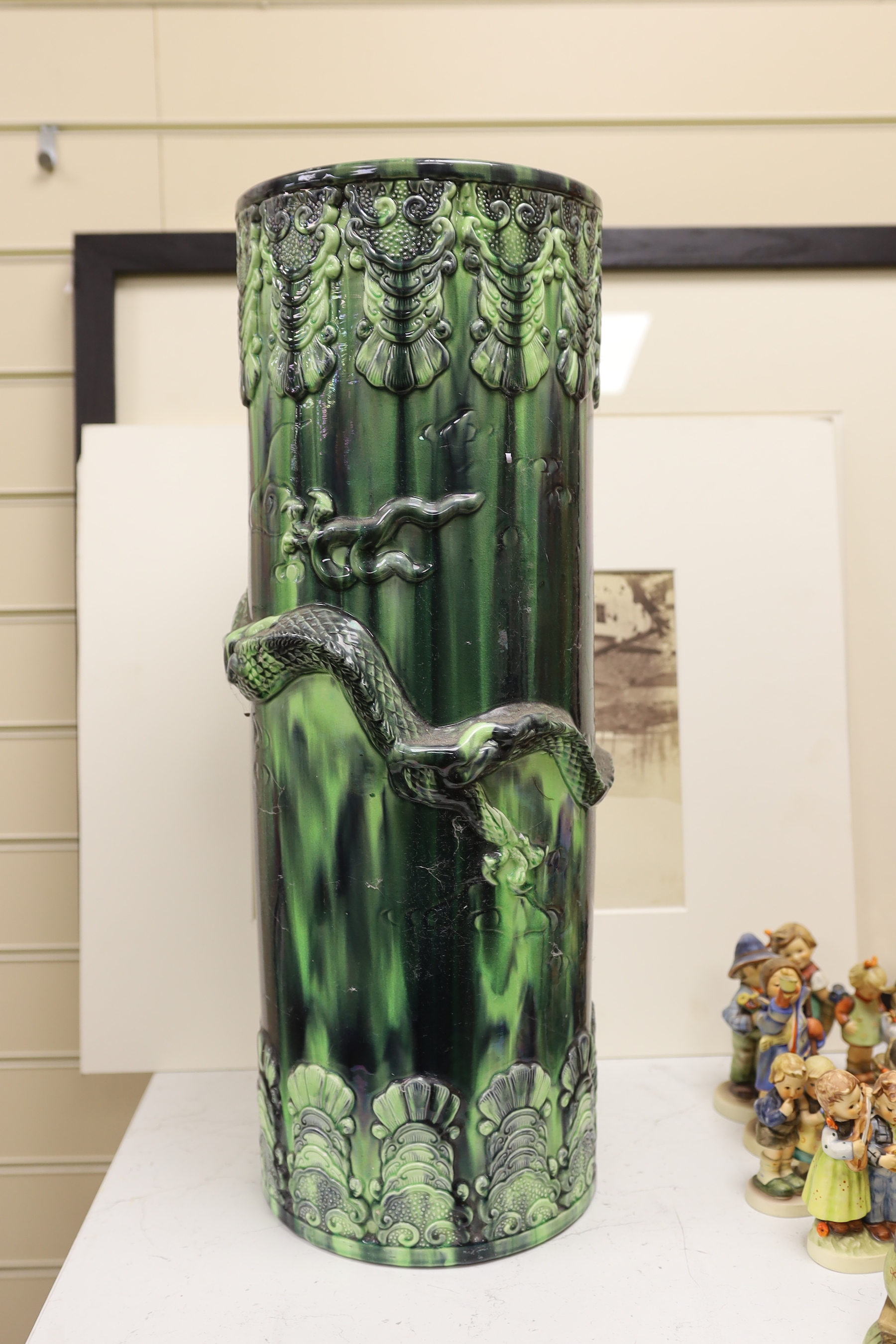 A Continental pottery dragon stick stand, 61cm